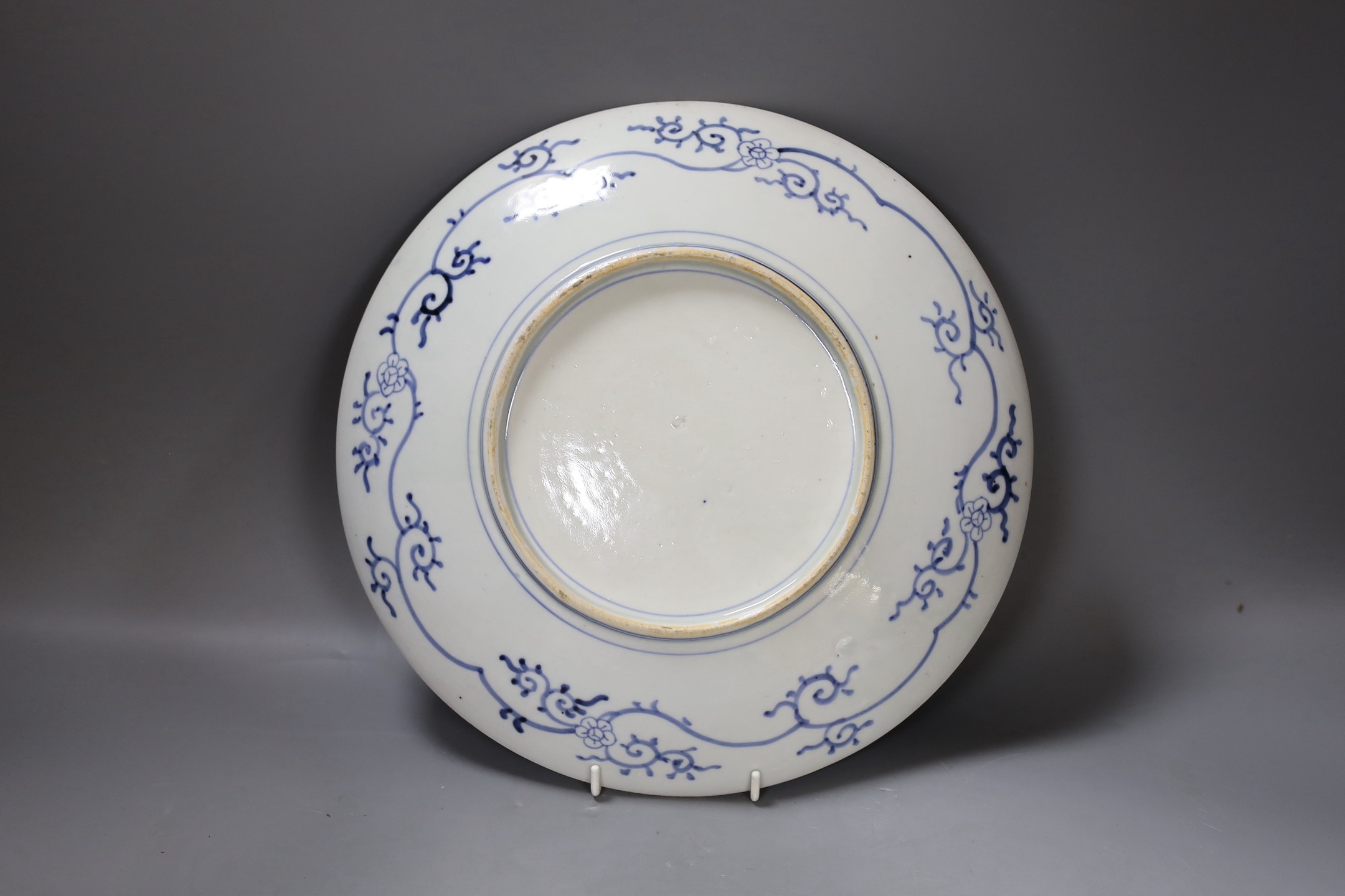 A Satsuma charger with decorative display and blue and white decoration to reverse, 31cm diameter